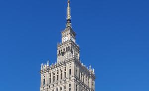 a tall building with a clock tower on top of it at Better Place Varso Center in Warsaw