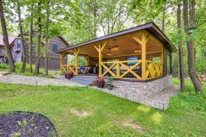 a home with a pavilion in the woods at Custom-Built Clarklake Cabin Sauna and Cold Plunge! in Clarklake