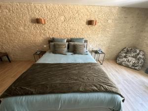 Letto o letti in una camera di Chambres d’hôtes de l’Ancienne Auberge