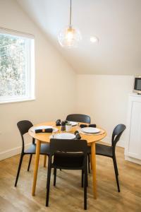 a dining room with a table and chairs at Life Elevated Loft: Bright, Prime Location + SAUNA in Salt Lake City