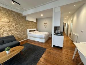 a bedroom with a bed and a living room at Oktheway Real 45 in A Coruña