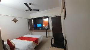 Postel nebo postele na pokoji v ubytování HOTEL S K PALACE