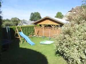 a playground with a gazebo and a slide at Ferienhaus-der-Familie-Demmler in Crottendorf