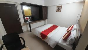 Postel nebo postele na pokoji v ubytování HOTEL S K PALACE