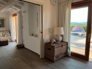 a living room with a door open to a patio at Chia Villa Violet in Chia