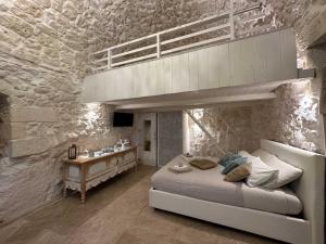 Posteľ alebo postele v izbe v ubytovaní Bianco Calce - Ostuni
