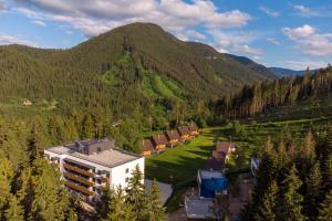 an aerial view of a building in the middle of a mountain at Apartmán Mendy in Liptovský Ján