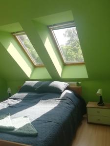 מיטה או מיטות בחדר ב-GingerBED Apartman
