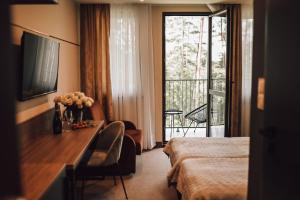 Posteľ alebo postele v izbe v ubytovaní Rytebłota Resort & Spa
