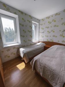 Ένα ή περισσότερα κρεβάτια σε δωμάτιο στο Apartment Jūros Mėlis