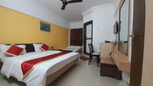Postel nebo postele na pokoji v ubytování HOTEL S K PALACE