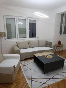 a living room with a couch and a table at Big Apartment Veles in Veles