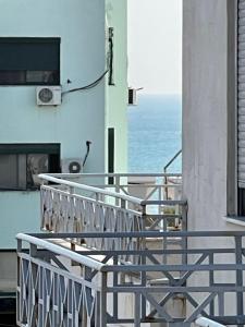 a balcony with a view of the ocean at Emi Apartment in Durrës