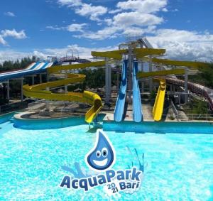 a water park with a water slide at a water park at B&B Torre Sibissi Bari in Triggiano