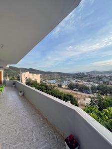 a balcony with a view of a city at Green Garden Villa in Ksamil