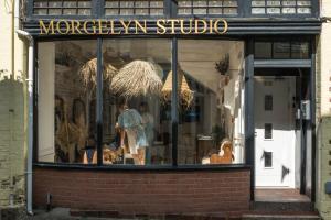 a display window of a store with mannequins in it at Contemporary First Floor Apartment Central Penzance in Penzance