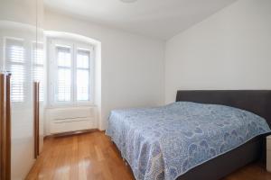 Ein Bett oder Betten in einem Zimmer der Unterkunft Apartment Mislav