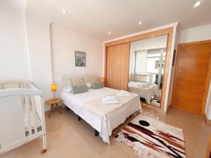 מיטה או מיטות בחדר ב-Homely Málaga Soho 520