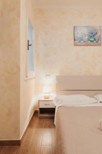 Ένα ή περισσότερα κρεβάτια σε δωμάτιο στο Appartamento del Corso