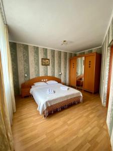 Giường trong phòng chung tại Вілла Мозола