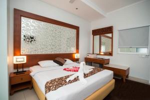 Postel nebo postele na pokoji v ubytování Samsara Inn + 37 fotografií