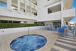 a hot tub in the middle of a building at Space Holiday Apartments in Maroochydore
