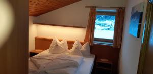 Postel nebo postele na pokoji v ubytování Residence Haus Peder