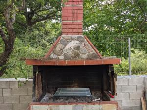a brick oven with a horse painted on it at Anchorage Apartment in Rachoni in Rachonio