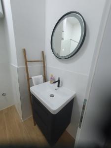 a bathroom with a sink and a mirror at MB Apartman in Čapljina