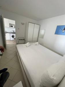 a bedroom with a large white bed in a room at Apartment A2 - Prvi zal in Lumbarda +47 photos
