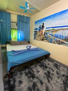 Postel nebo postele na pokoji v ubytování Daltans Home Stay Siargao