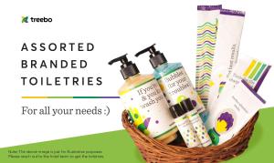 a basket ofented branded toothbrushes and cosmetics at Treebo The Qasr in Cochin