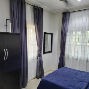 En eller flere senge i et værelse på 247 City Apartment - Home away from home