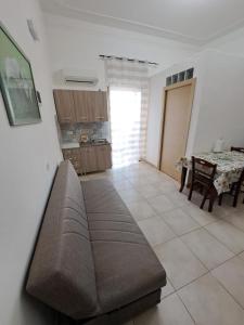a living room with a couch and a table at Casa Vacanze Vista Mare in Agrigento +15 photos