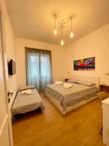 Ein Bett oder Betten in einem Zimmer der Unterkunft La casa di Toto smart