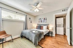 a bedroom with a bed and a ceiling fan at Hello Gorgeous Flat near Downtown! in Dallas