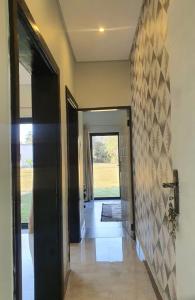 a hallway of a house with a door and a hallwayngthngthngthngthngth at Chuumba Villas in Lusaka