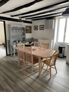 a dining room with a table and chairs at Lovely French Farmhouse with Private Swimming Pool in Bourganeuf