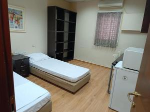 Postel nebo postele na pokoji v ubytování Coral guest house Netanya
