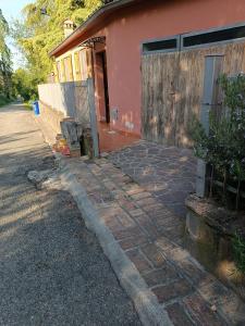 a brick sidewalk in front of a house at Anime Salve B&B HOME RESTAURANT 
