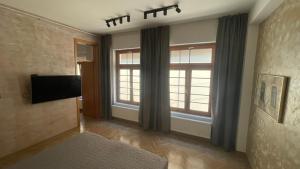 TV a/nebo společenská místnost v ubytování Corso Apartment