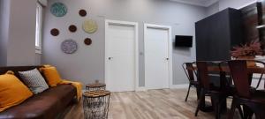 a living room with a couch and a table at Cruces Hospital Metro in Barakaldo