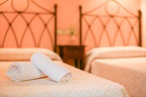 Кровать или кровати в номере Apartamentos Rurales El Cuetu