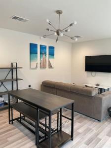 a living room with a couch and a table at Lake home on 3 acres in Mabank