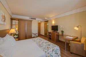 Cama ou camas em um quarto em Blue Tree Towers Caxias do Sul