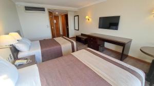 Postel nebo postele na pokoji v ubytování Hotel Diego de Almagro Valparaíso + 26 fotografií