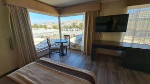 Postel nebo postele na pokoji v ubytování Hotel Diego de Almagro Valparaíso