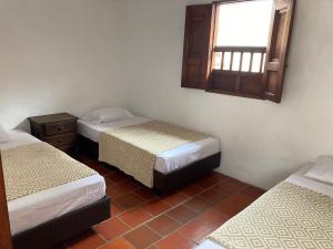 Voodi või voodid majutusasutuse Casa en Barichara toas