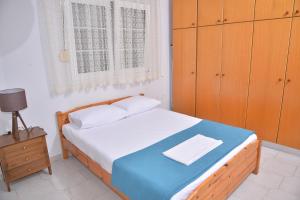 Postel nebo postele na pokoji v ubytování ZeusPlace Konaki House Leptokarya