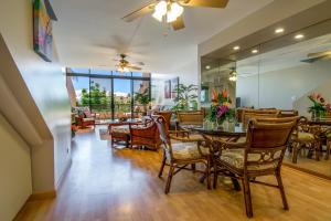 a dining room with a table and chairs at Kahana Villa E409 in Kahana